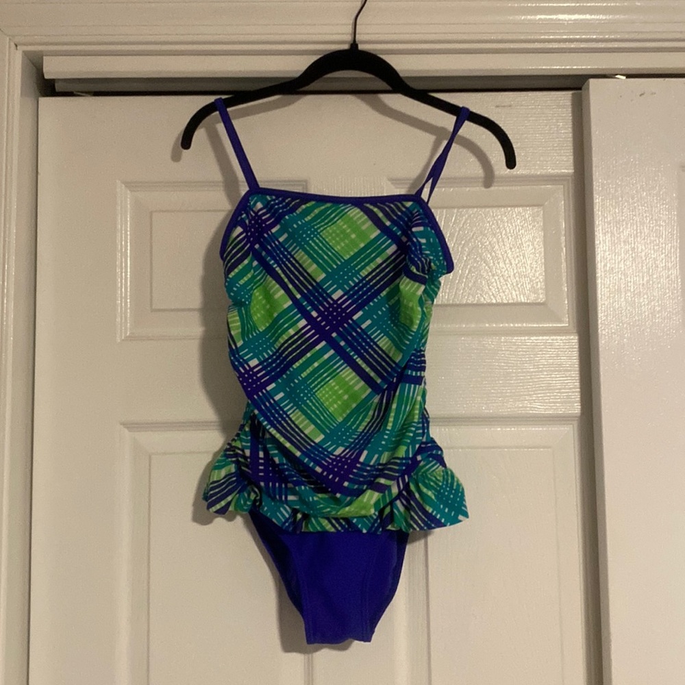 Candie’s girl’s bathingsuit. Ruffles around the waist. Straps not adjustable.